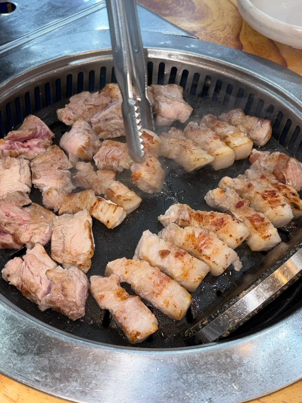 Thick pork belly grilling on the grill plate