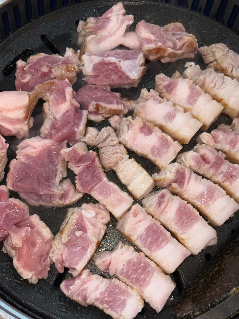 Staff member grilling the meat