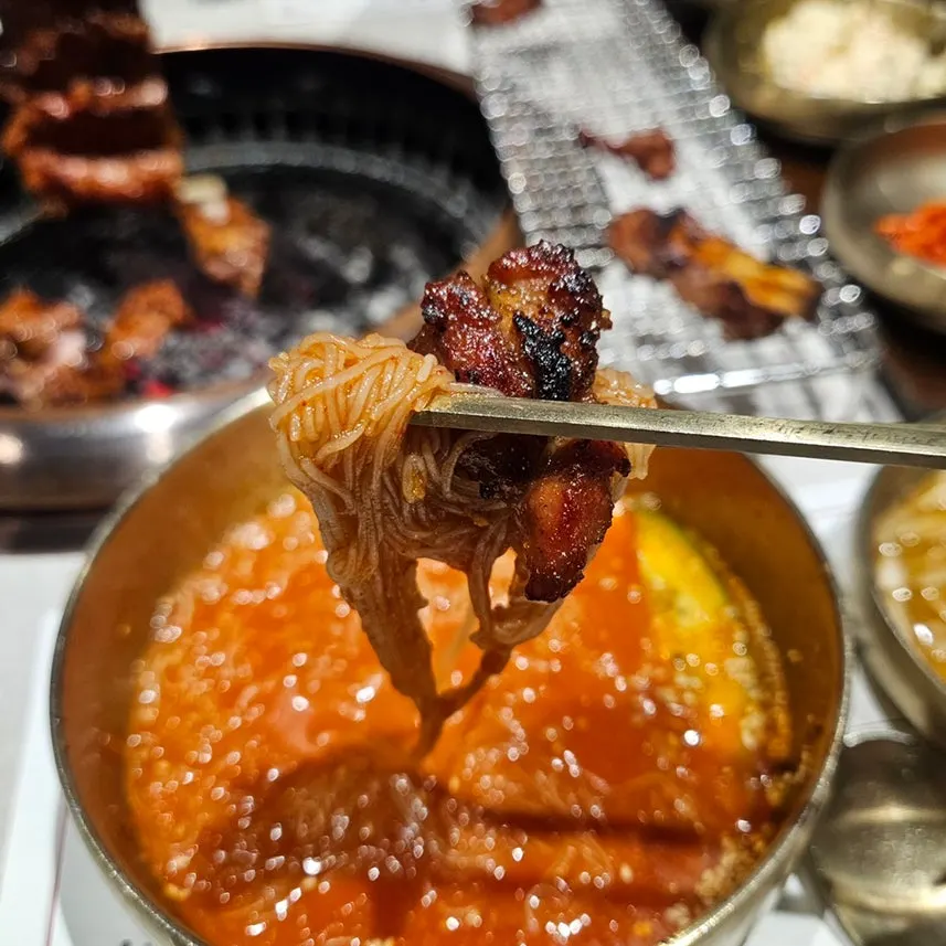 Spicy naengmyeon enjoyed alongside the galbi