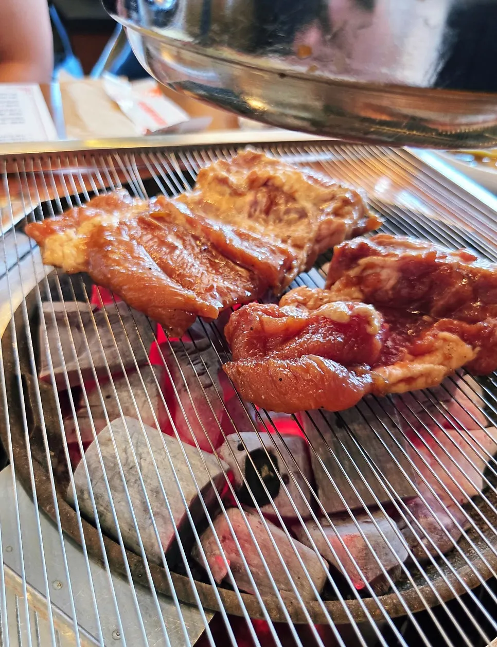Pork galbi cooking over the charcoal