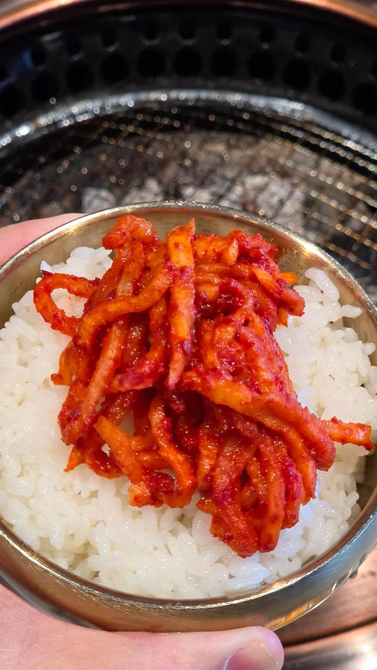 Rice mixed with spicy radish salad on the table