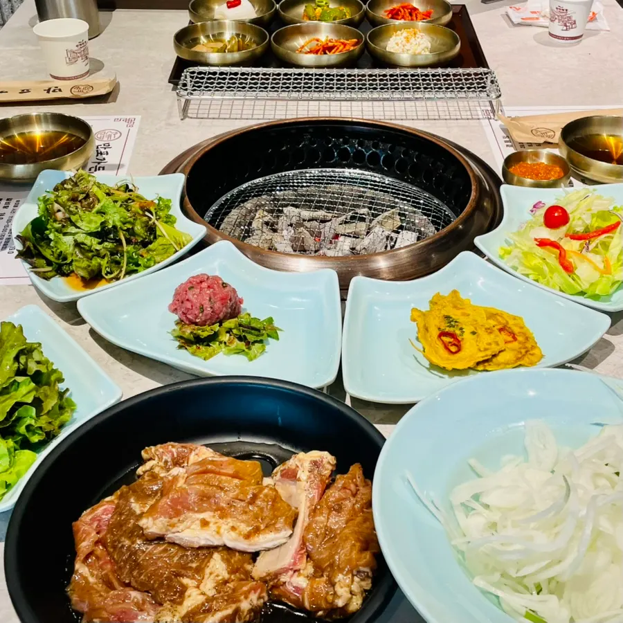 Manpo Garden galbi with basic side dishes on the table