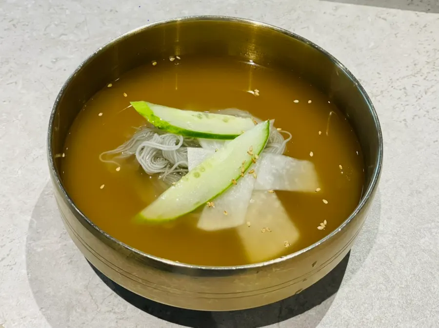 Free handmade Hamhung naengmyeon served at the table