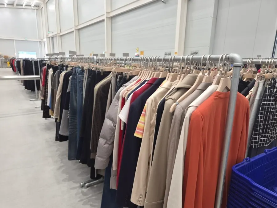 Long rows of warehouse-style clothing hangers