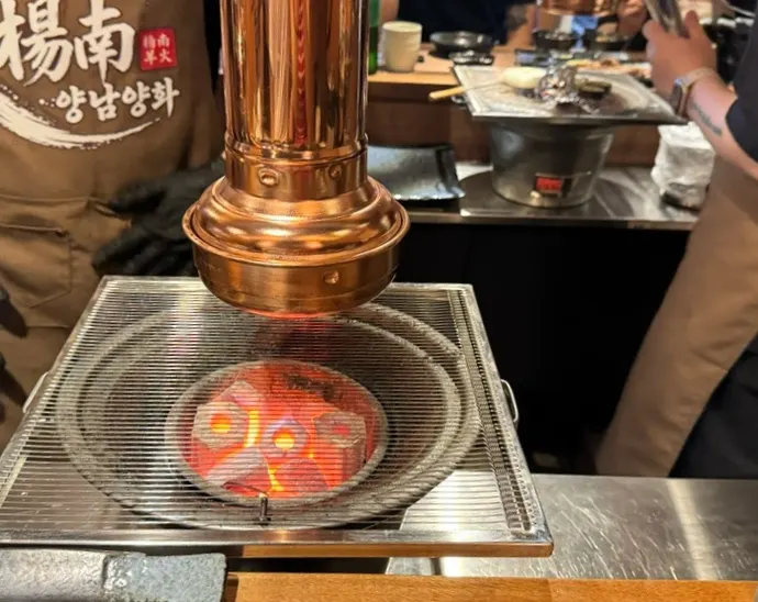 Charcoal fire placed in front of the table