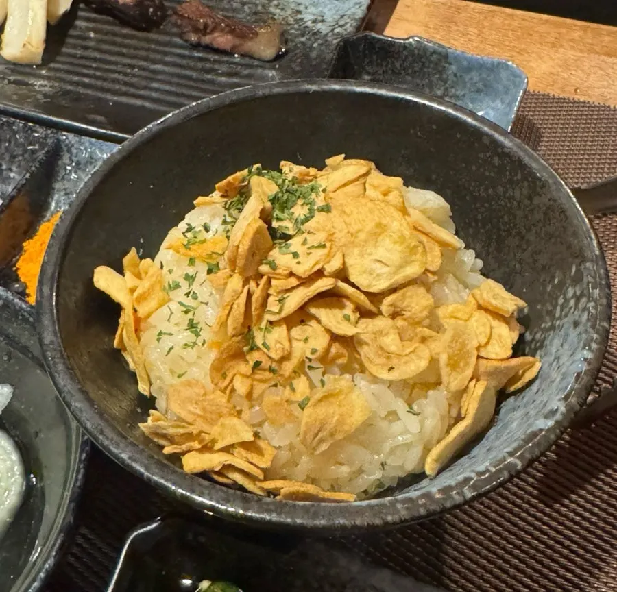 Garlic rice topped with garlic flakes