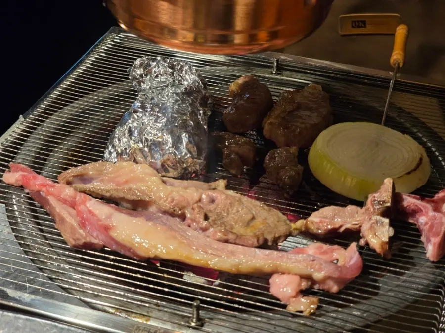 Thick lamb ribs grilled by staff