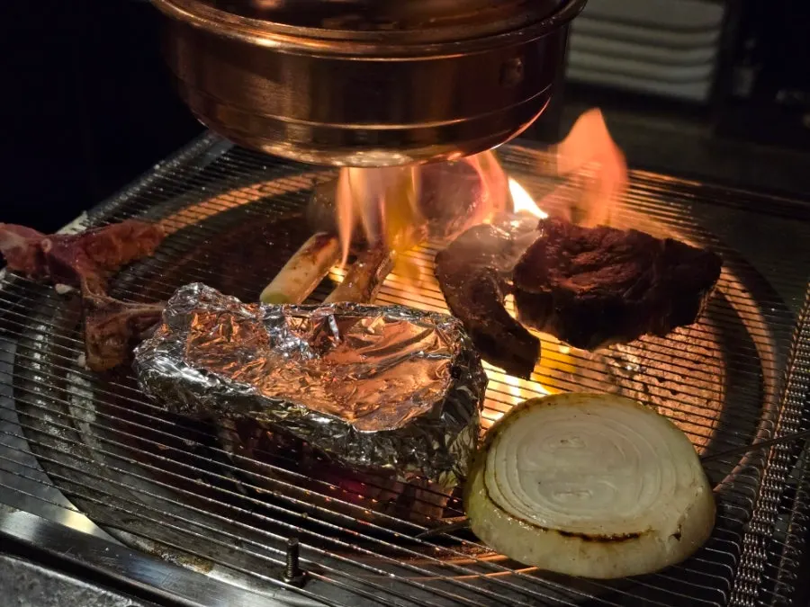 T-bone steak cut being grilled