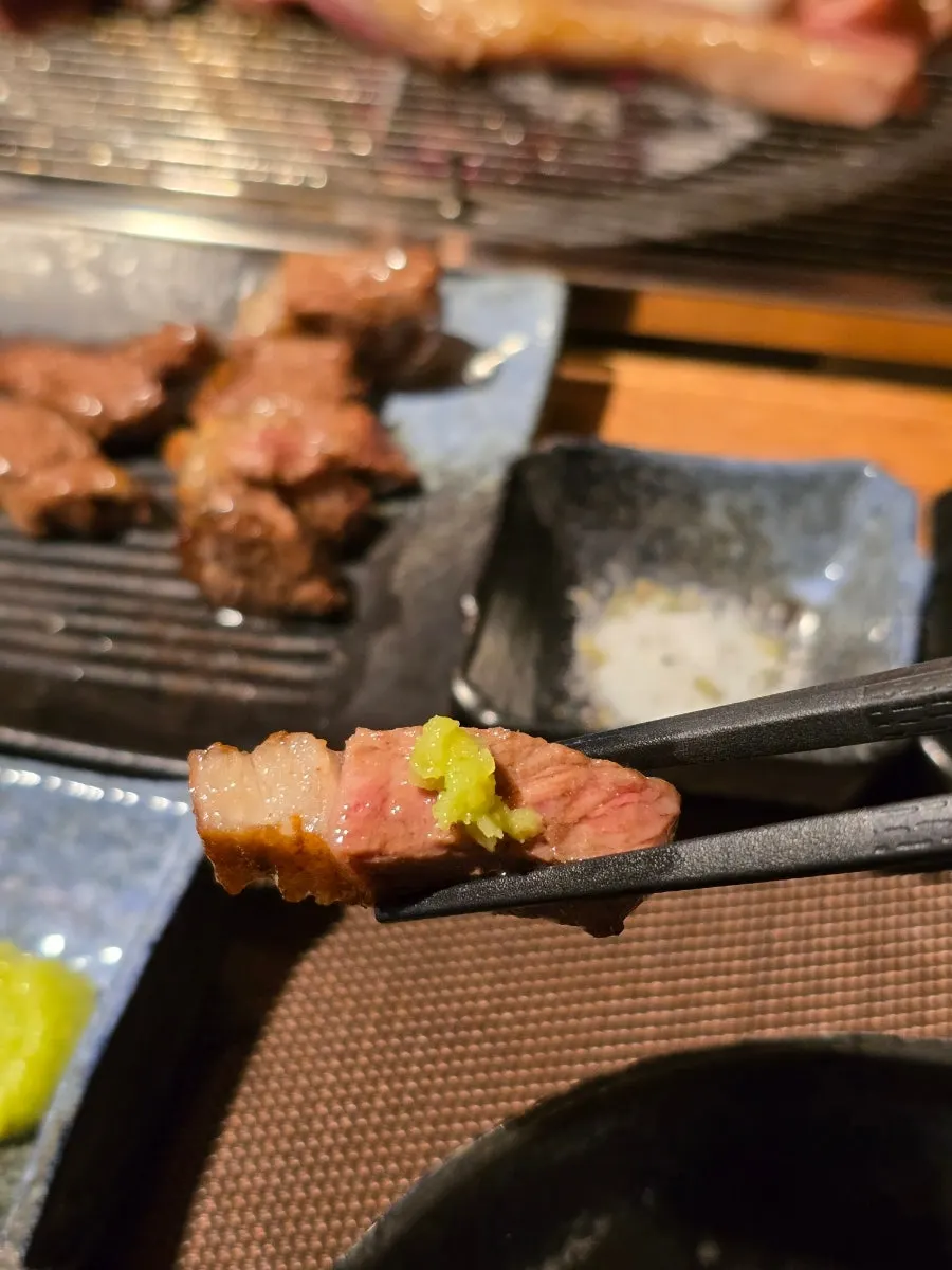 A piece of lamb rib topped with mint jelly