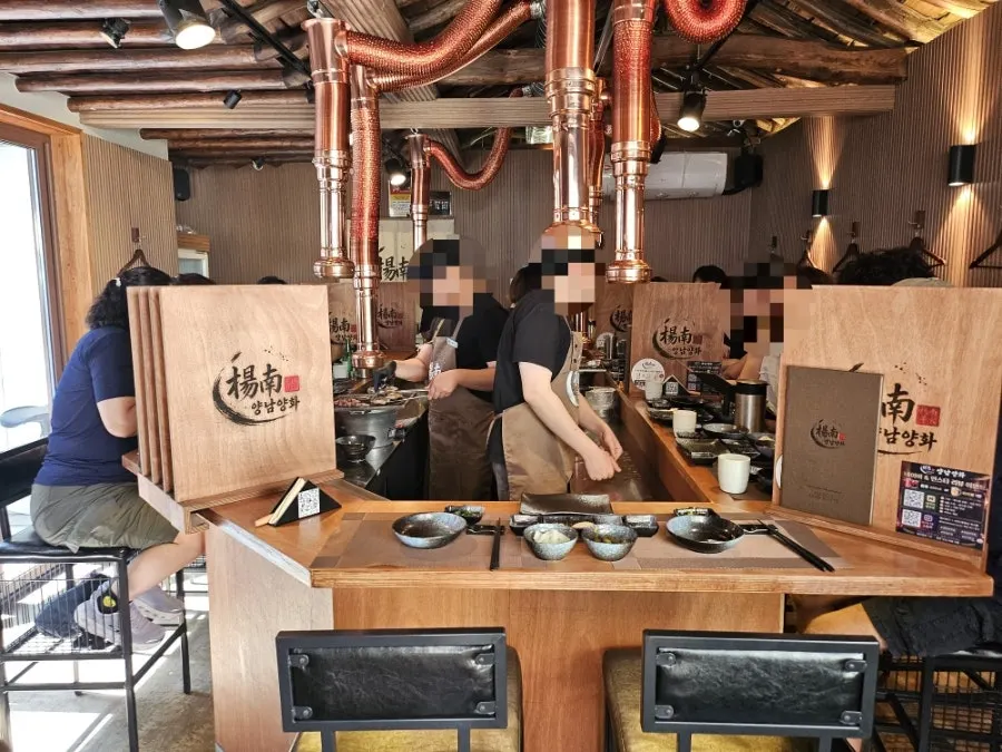 Interior tables at Yangnam Yanghwa filled with customers