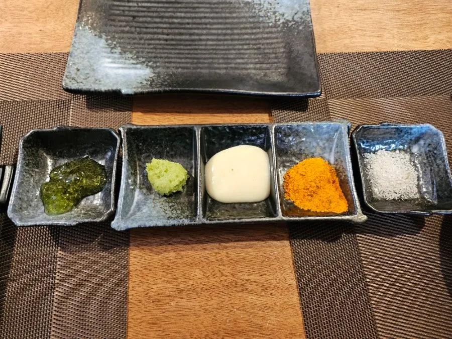 Five sauces pre-set at the reserved table