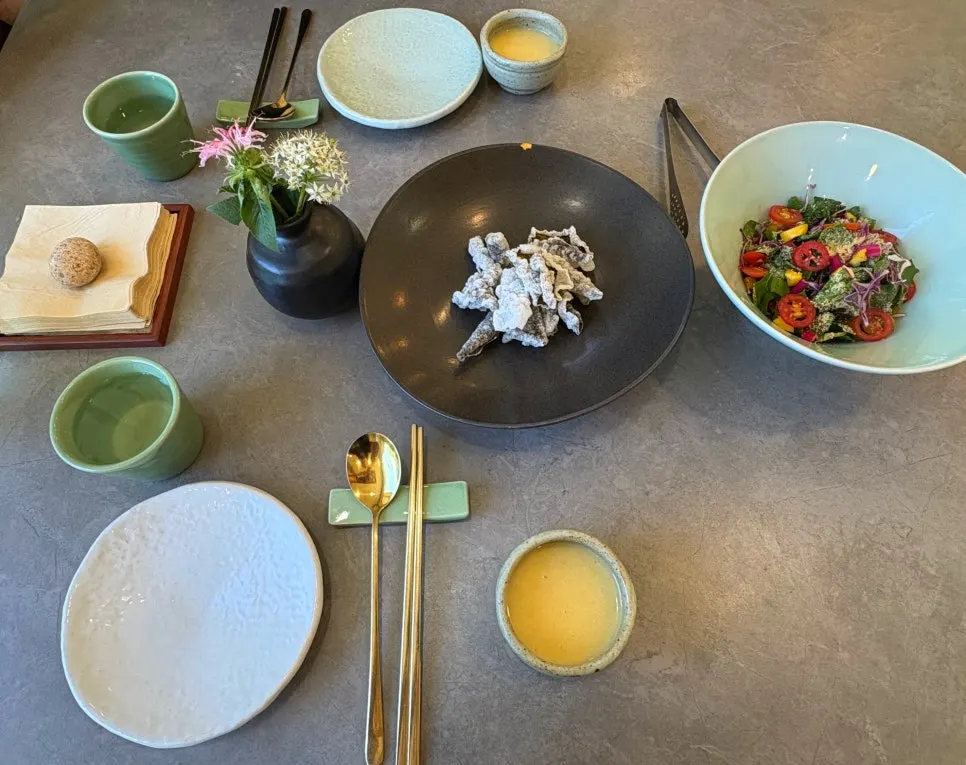Welcome dish, seasonal porridge, and salad served together