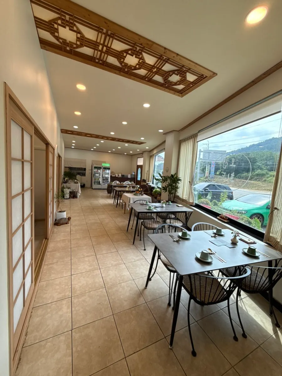 Wood-tone tables inside Ochan Hoedong