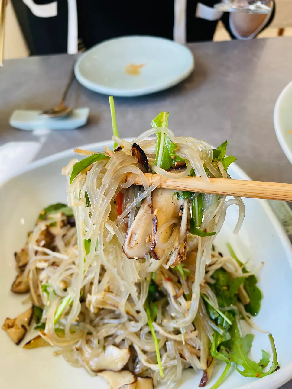 Yangpyeong mushroom japchae topped with arugula