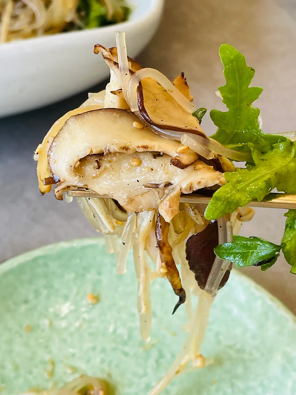 Close-up of the japchae with peperoncino on top