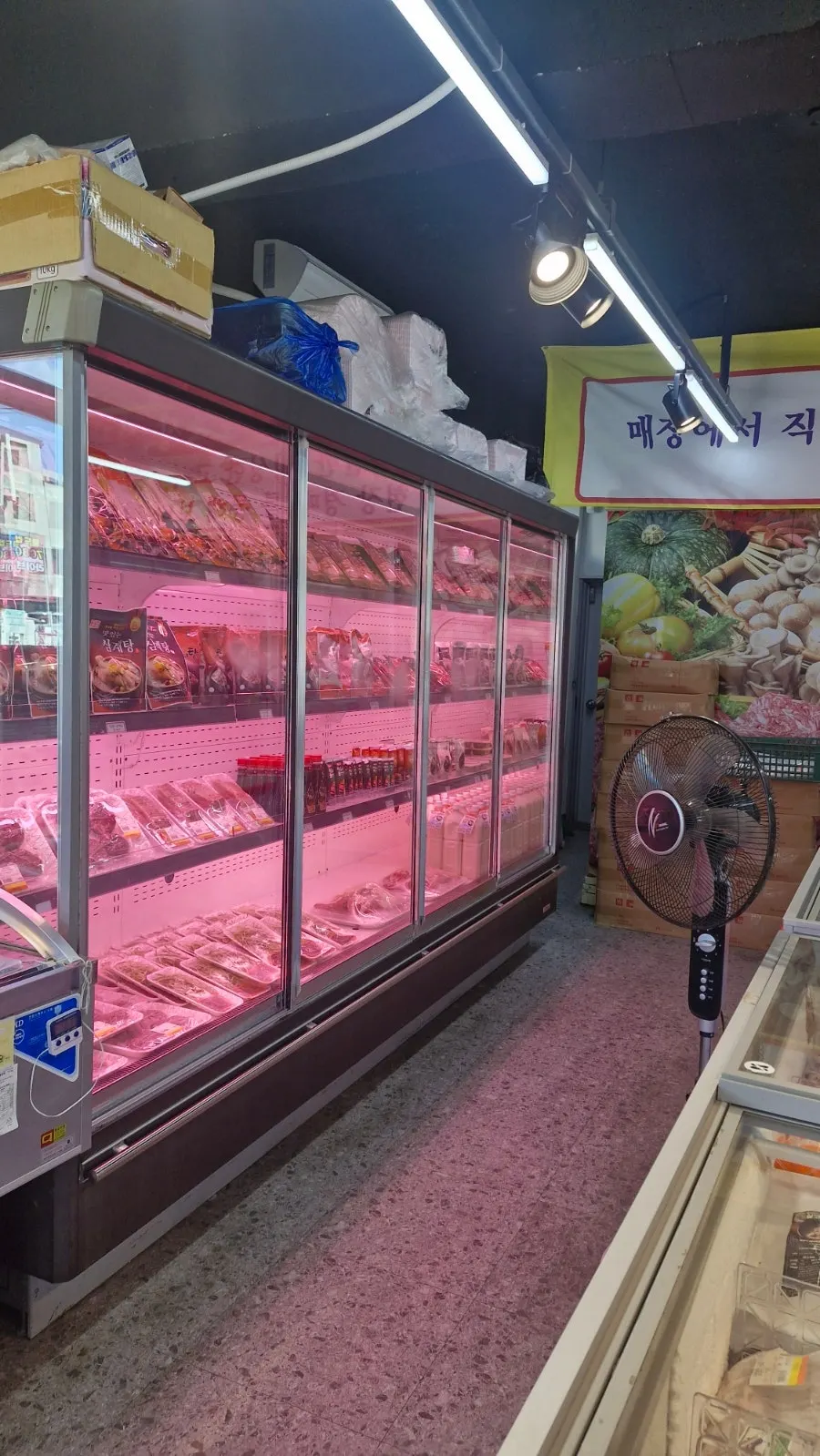 Butcher shop sign with a 'bomb sale' banner
