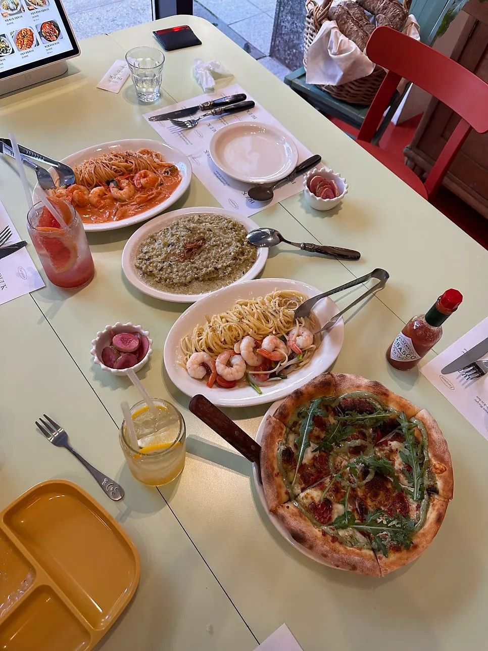 A whole basil margherita pizza