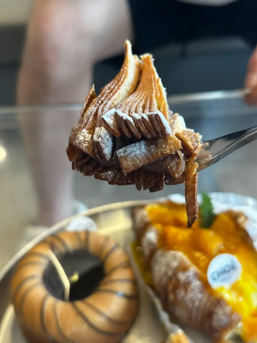 Croissant topped with mango flesh and cream