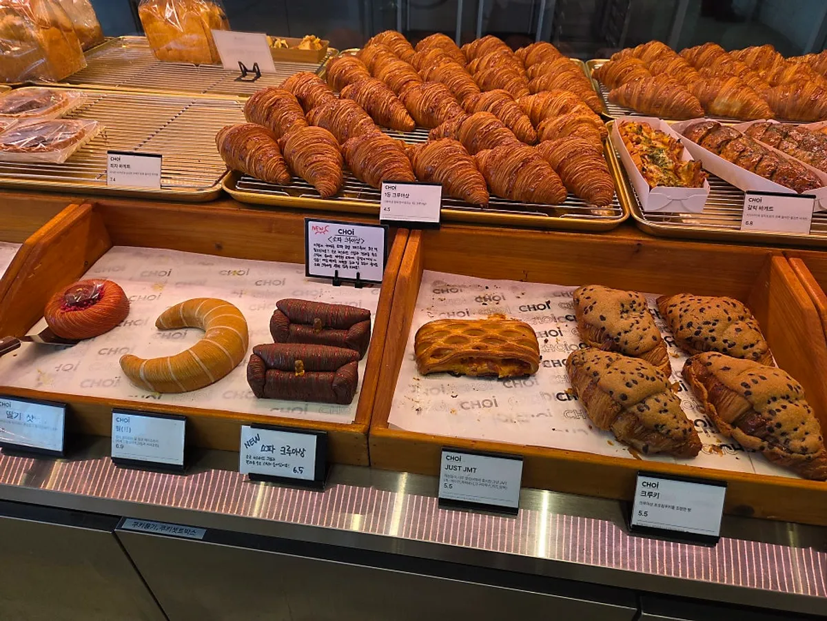 Choi's bread display filled with hard-crust baguettes