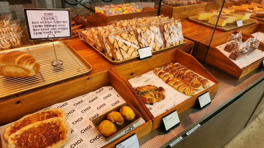 Display shelf of various breads at Choi bakery