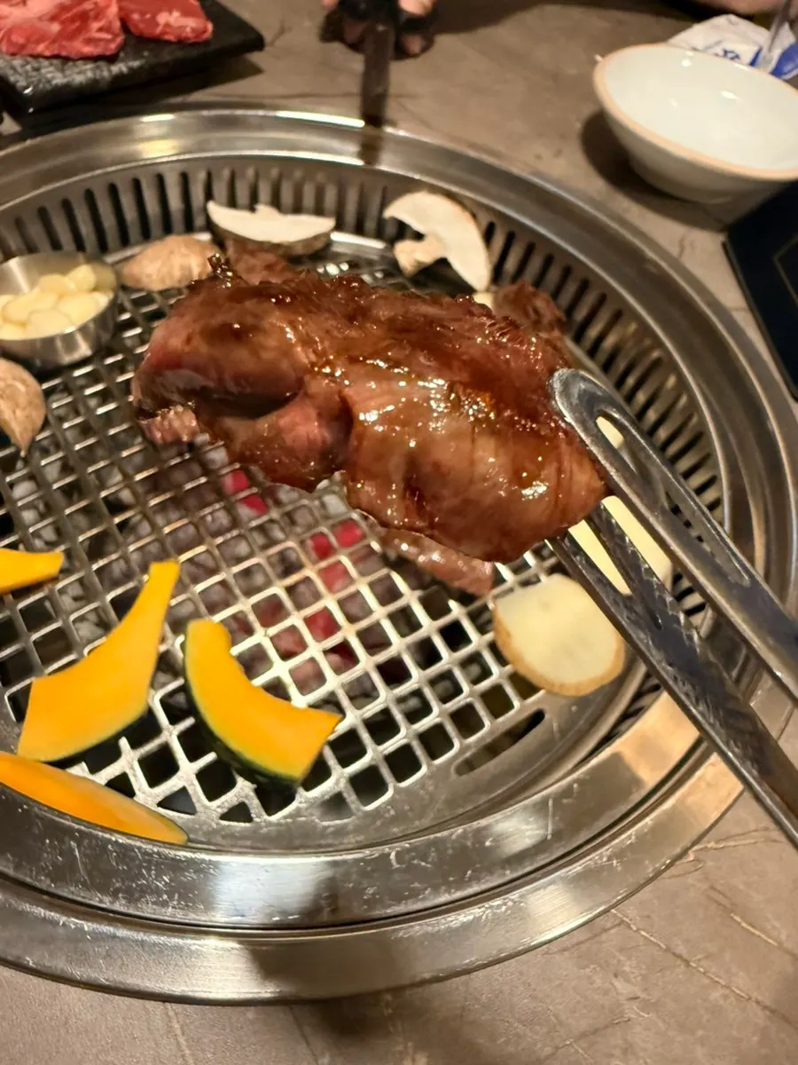Grilled Korean beef pieces cut with scissors