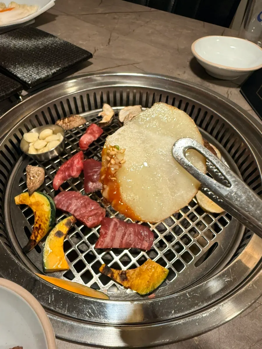 Well-grilled potato on the charcoal grill