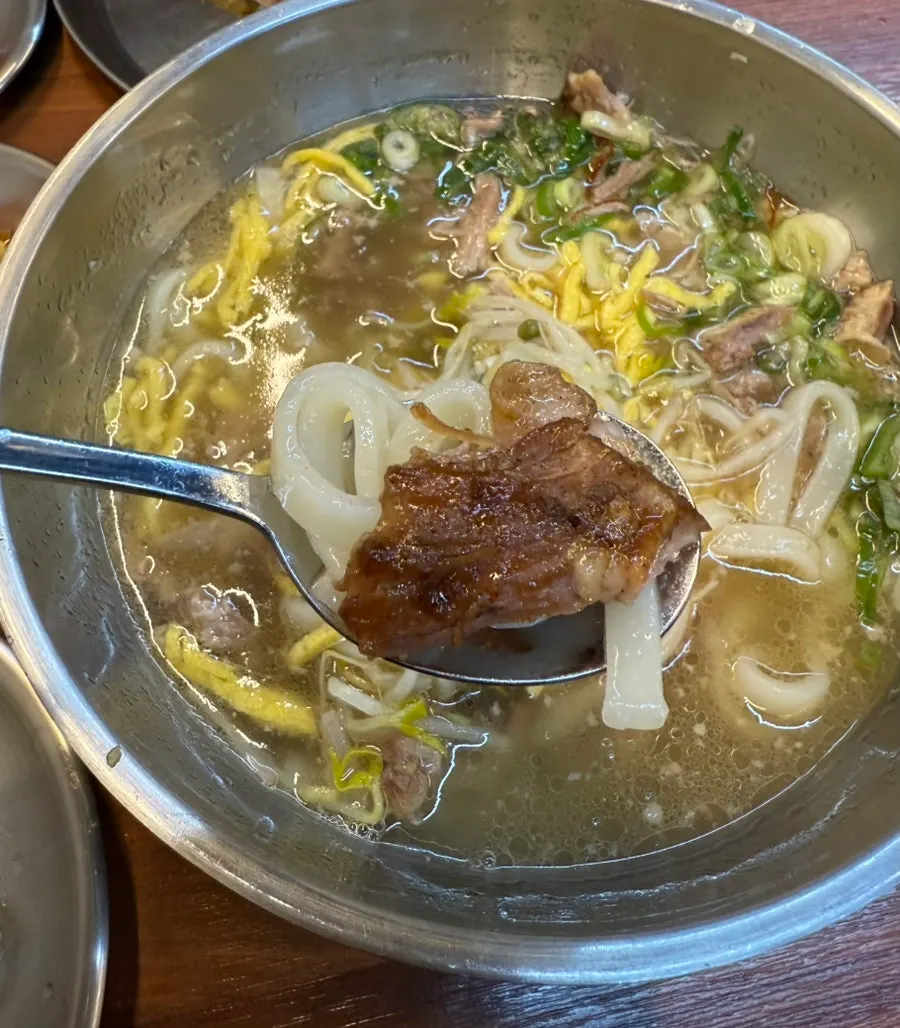 Meal of kalguksu and galbi-seasoned grilled bones