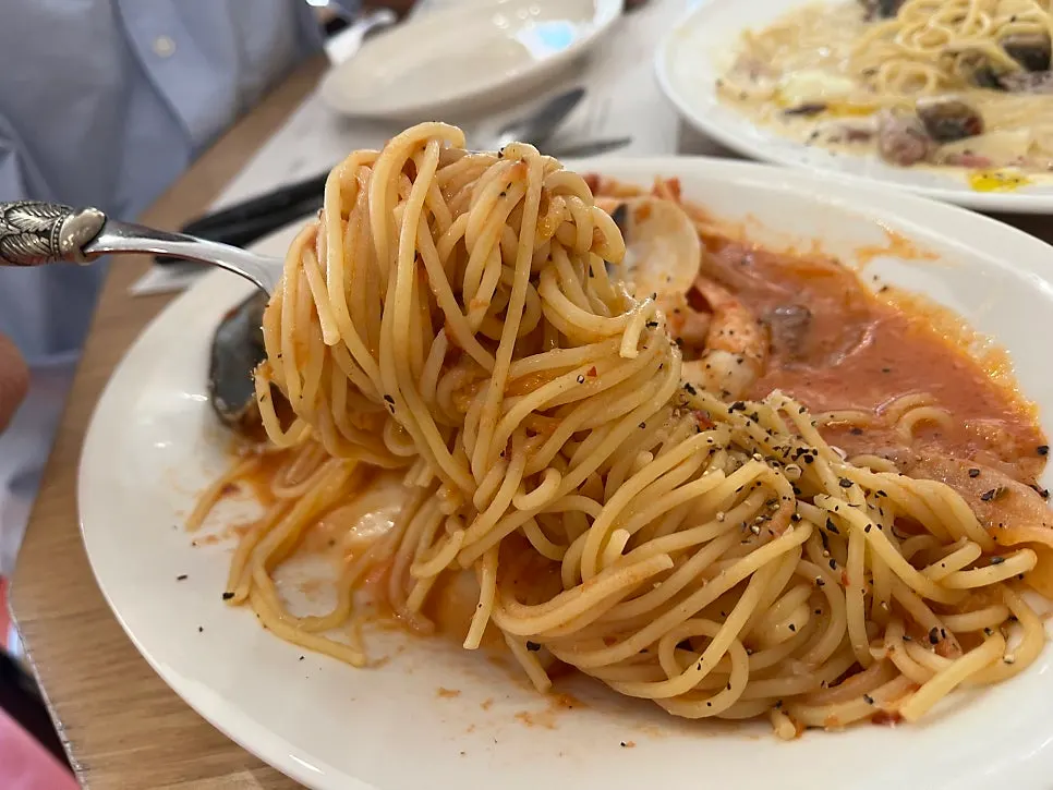 Carbonara noodles twirled on a fork