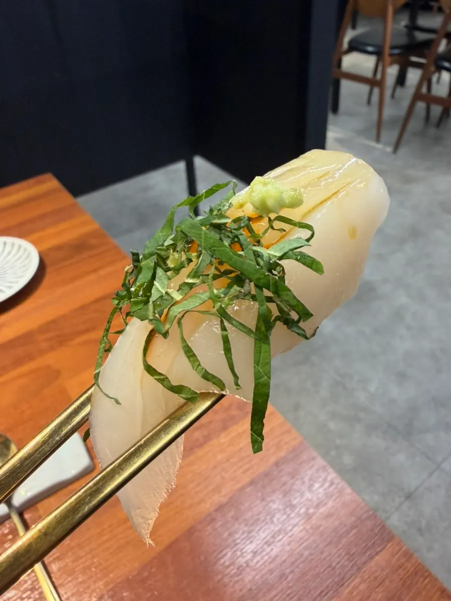 Squid sushi decorated with perilla leaf
