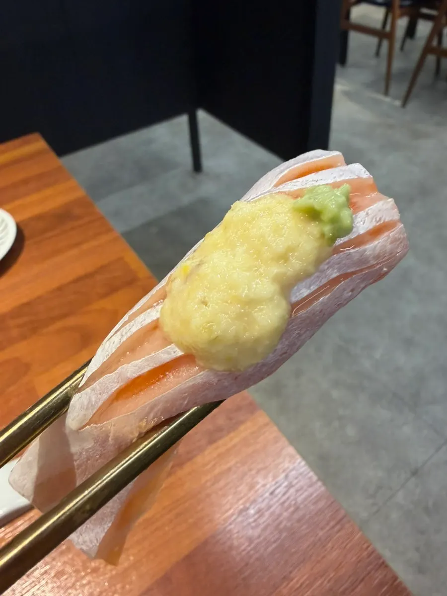 Salmon sushi with score cuts