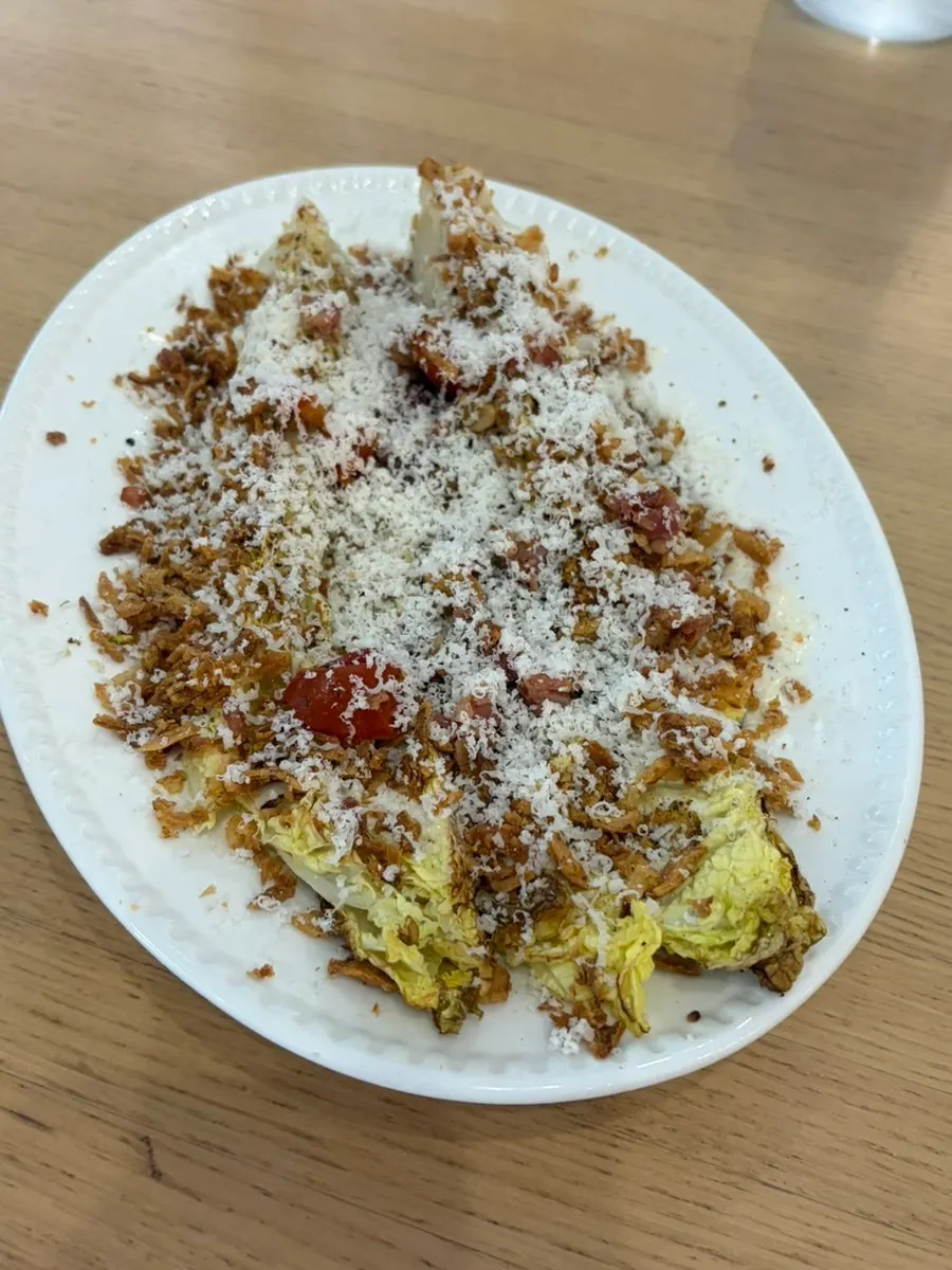 Italian meal served with Napa cabbage Caesar salad