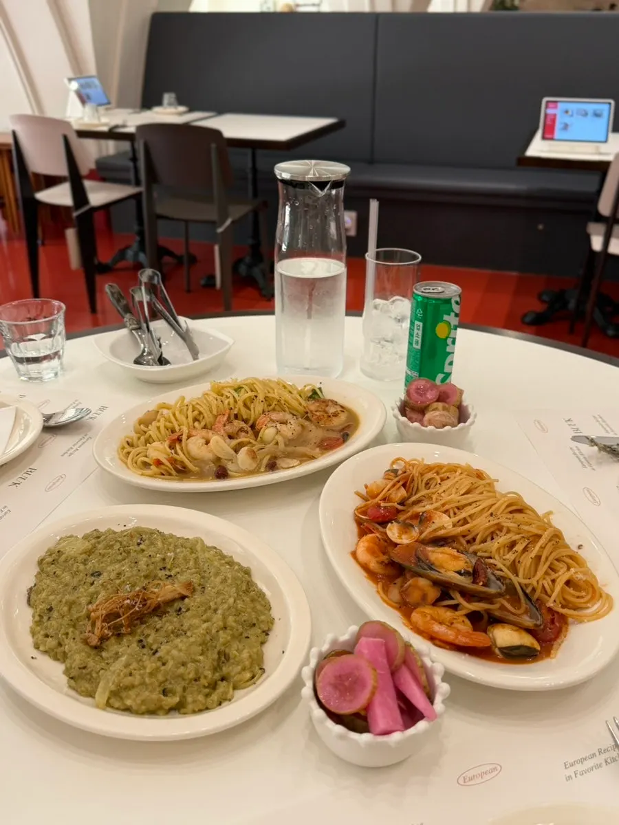 Three ordered plates of pasta and risotto
