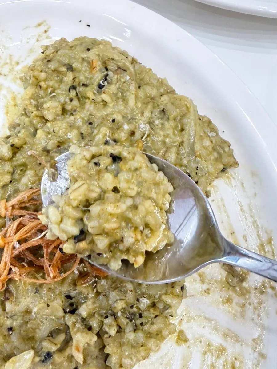 A spoonful of cream risotto with abalone meat