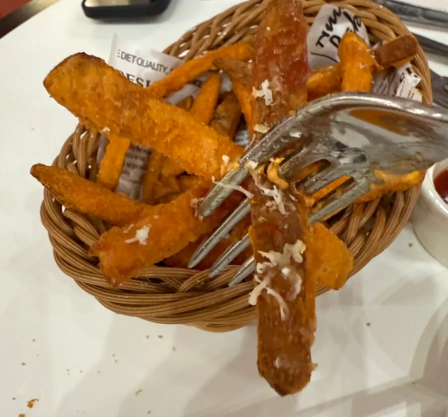 Sweet potato fries served with cola