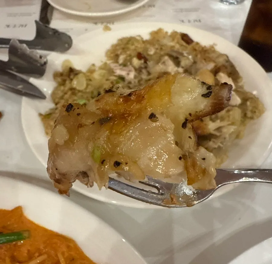 Chicken pilaf served with scissors and tongs