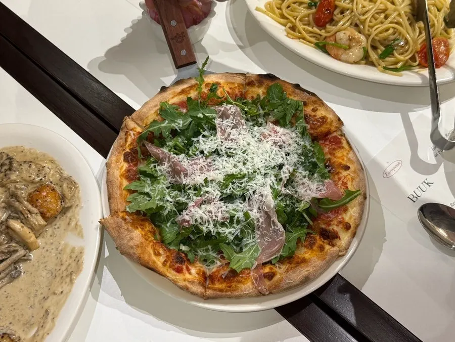 Colorful table spread of four Italian dishes
