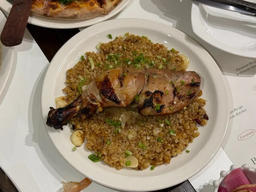 Kung pao chicken pilaf with a large chicken drumstick