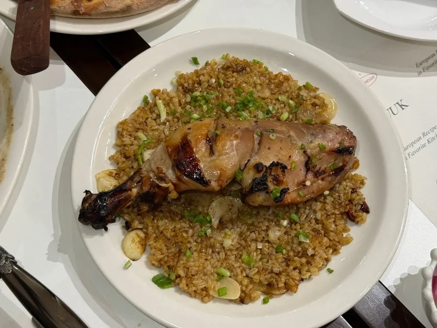 Close-up of sweet-spicy sauce on kung pao chicken pilaf