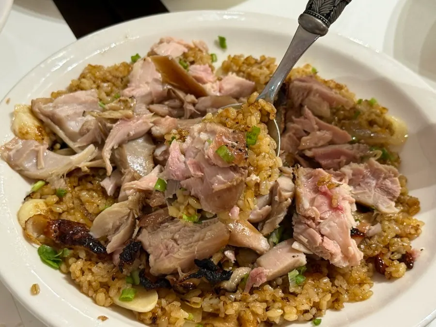 A spoonful of chicken and rice from the kung pao pilaf