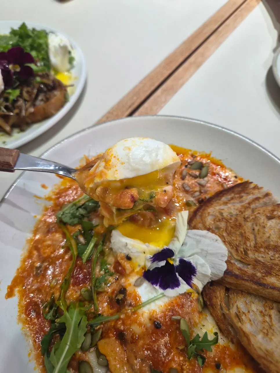 Egg-in-hell served with bread on the side