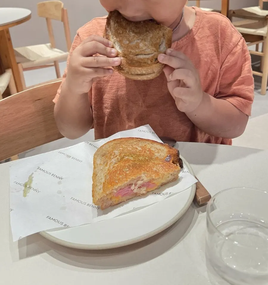 Cross-section of ham cheese toast with mozzarella and cheddar