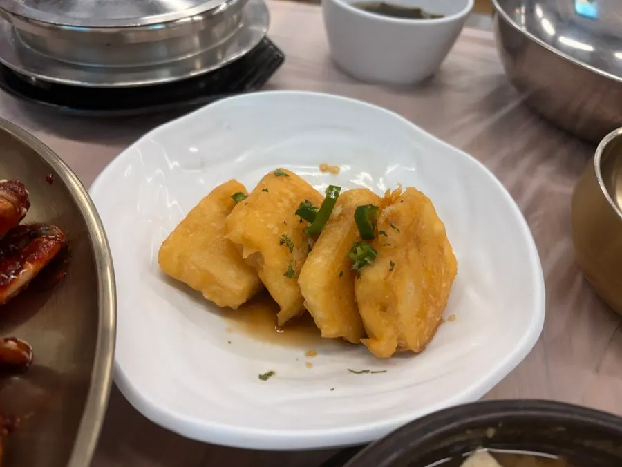 Side dish spread with fried tofu and seasoned vegetables