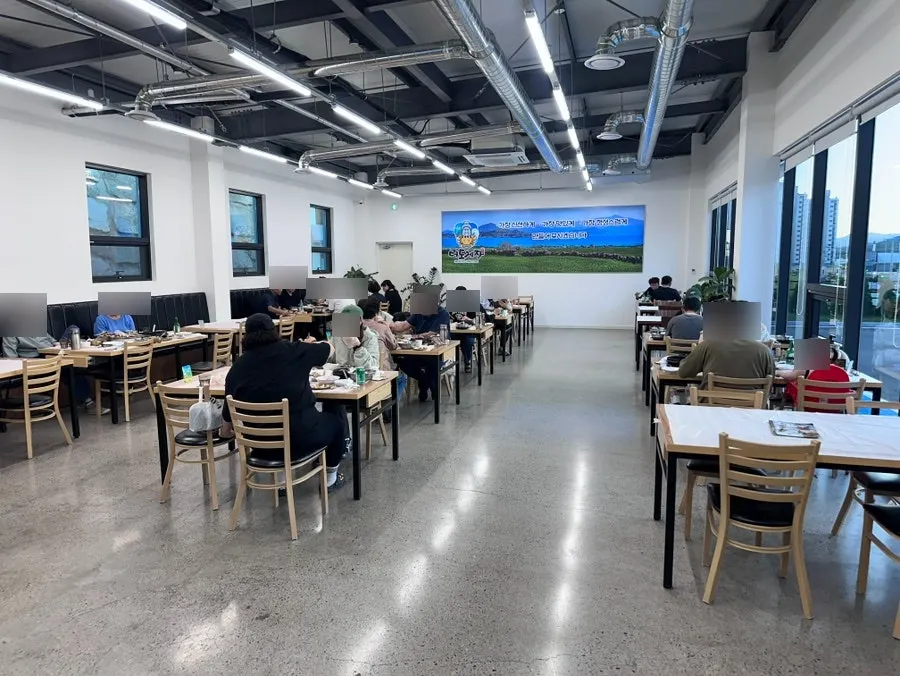 Full view of the dining hall with many tables
