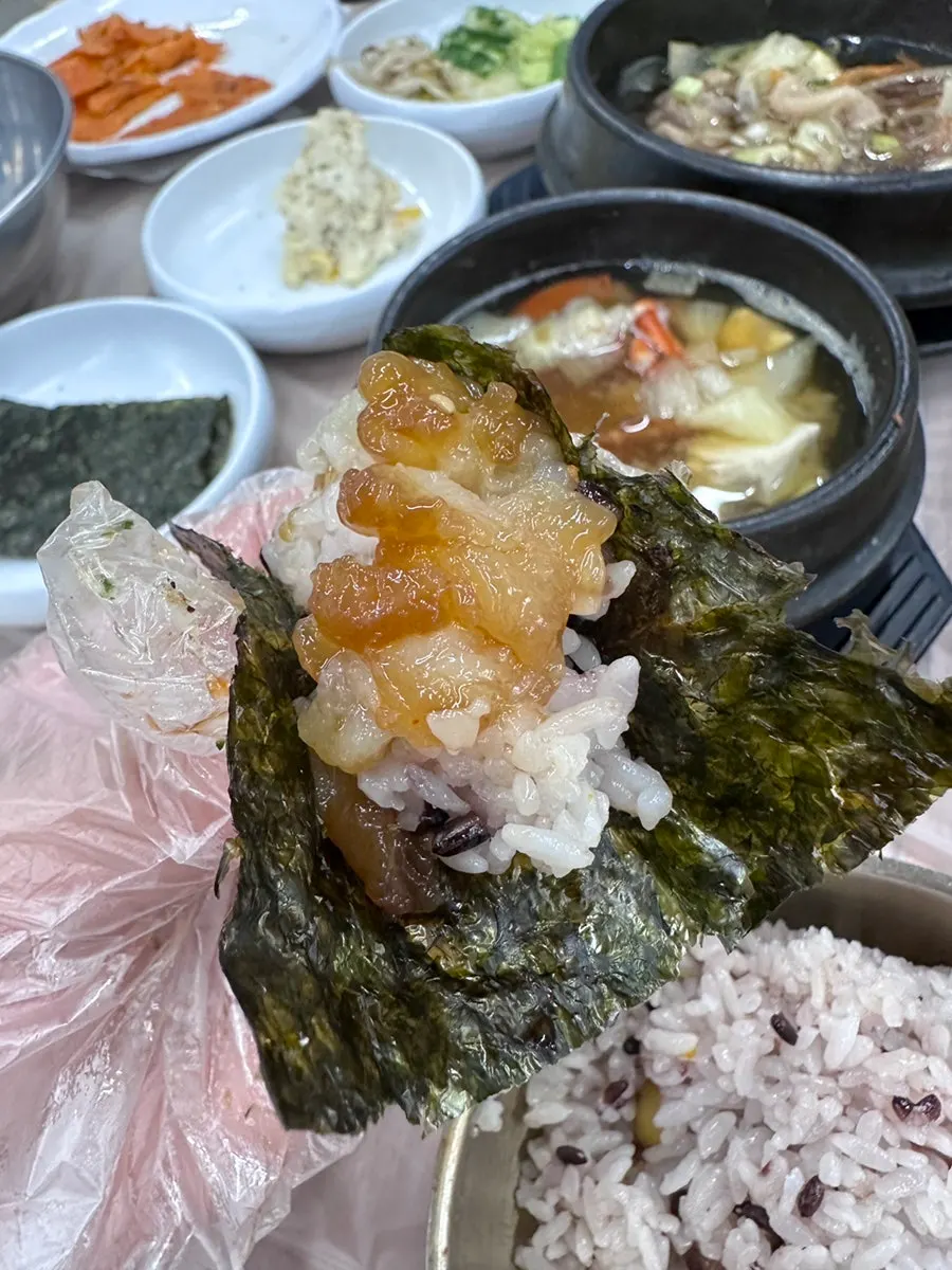 Soy crab meat squeezed out and placed on seaweed