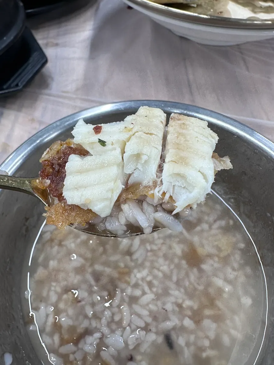 Fish meat laid over stone pot nurungji