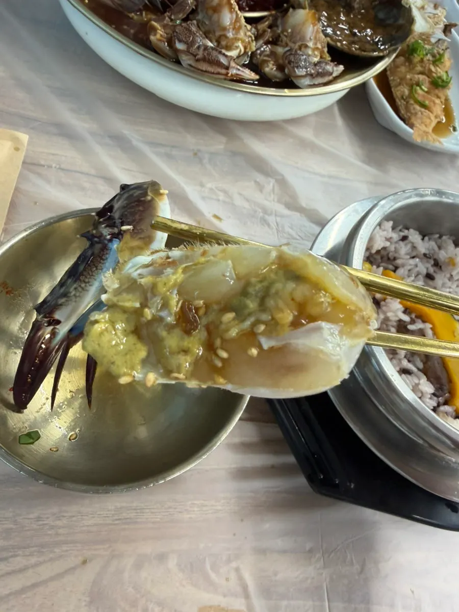 A spoonful of pot rice with soy crab jang