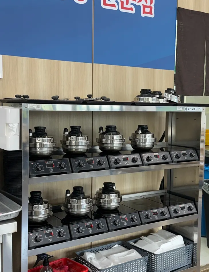 Pot rice being cooked in a corner of the restaurant