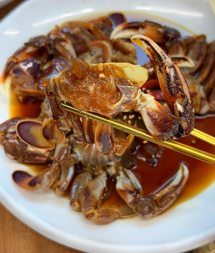 Close-up of crab soaked in soy sauce marinade