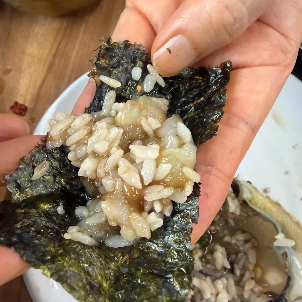 A spoonful of rice mixed in the crab shell