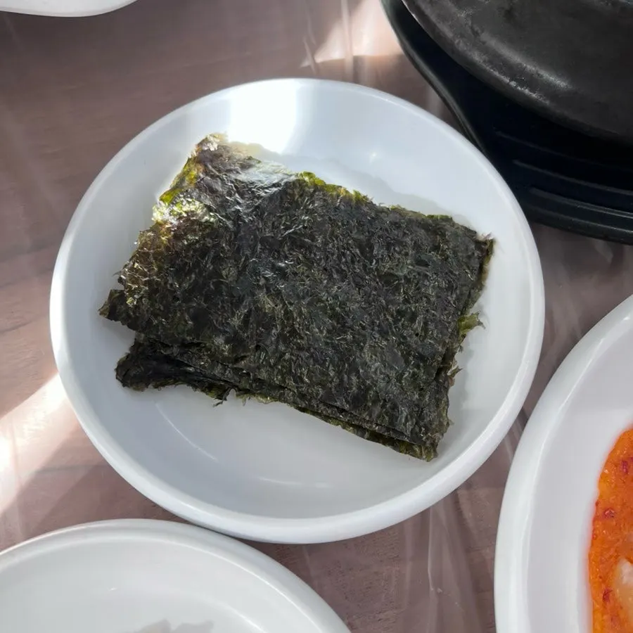 Grilled fish topped with tangy sauce